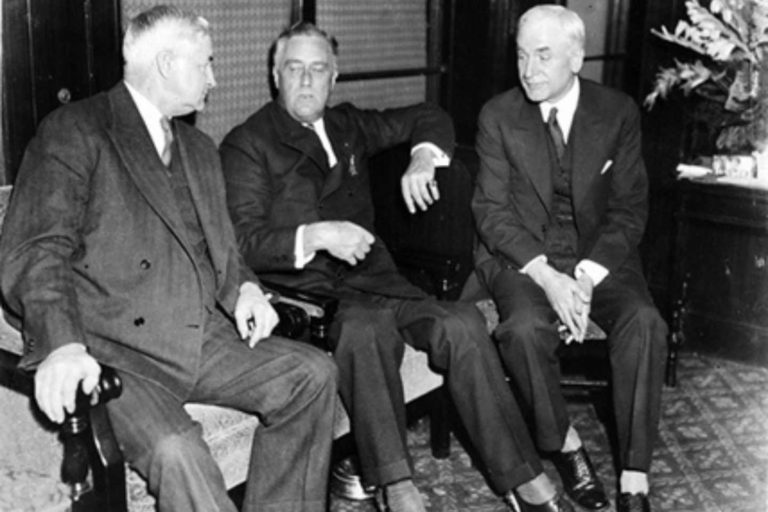 Jesse Jones, President-elect Franklin Roosevelt and then Senator Cordell Hull of Tennessee. In a rare instance, Roosevelt's leg braces are visible in the picture. Courtesy of CORBIS.
