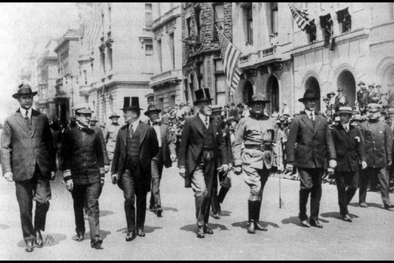 (left to right) Jesse Jones, Admiral Cary T. Grayson, Joseph Tumulty, and President Woodrow Wilson marching down Fifth Avenue during the immense American Red Cross fundrasing on May 18, 1918. Courtesy Campbell Photo Services.